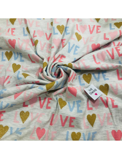 Poppy - Tissu Jersey de Coton Imprimé "Glitter LOVE" sur le Fond Gris Chiné